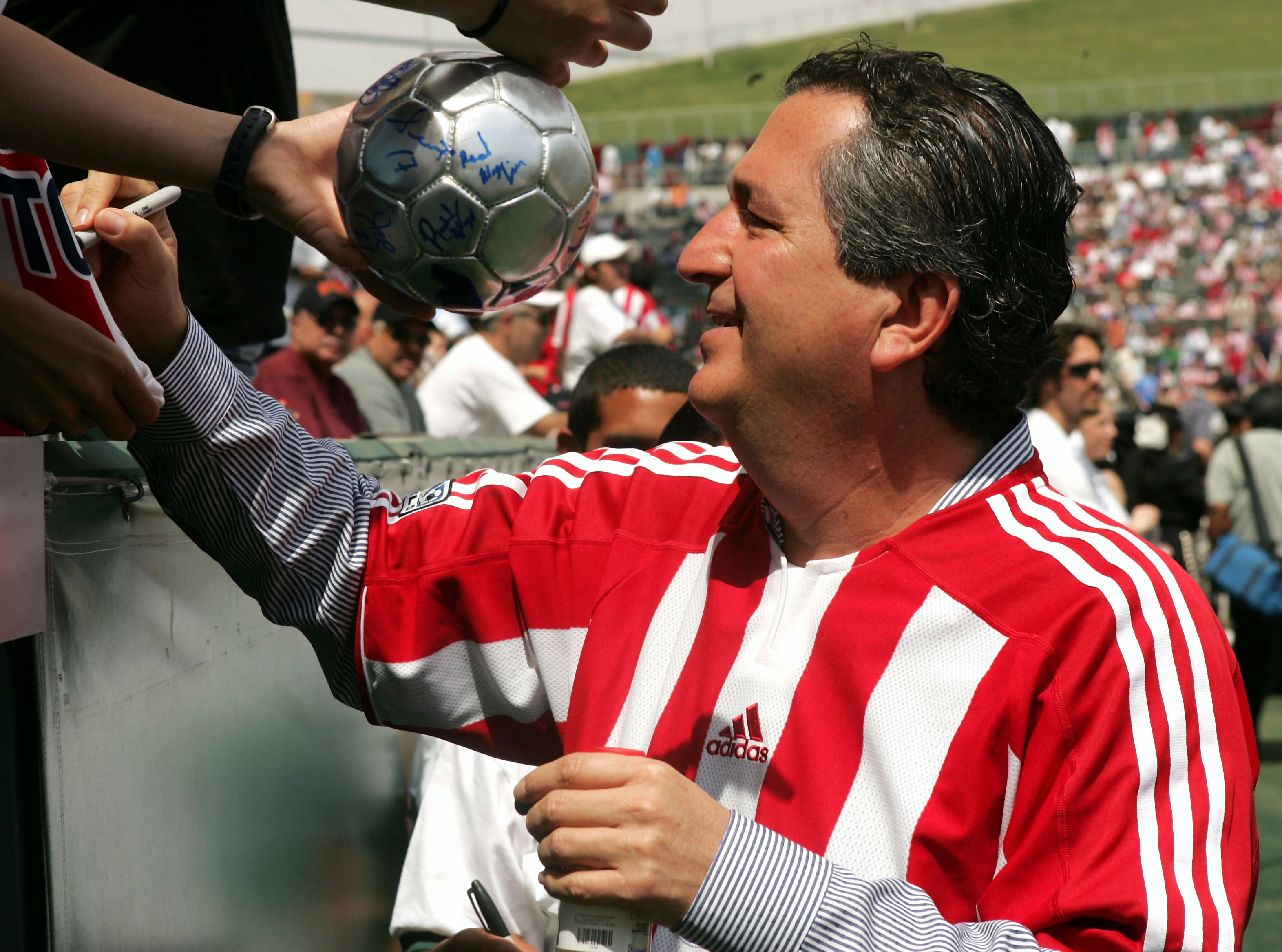 CARSON, CA - APRIL 2:  Owner Jorge Vergara of Chivas USA signs autographs before their inaugural Major League Soccer match with DC United on April 2, 2005 at the Home Depot Center in Carson, California. DC United won 2-0.  (Photo by Stephen Dunn/Getty Images)